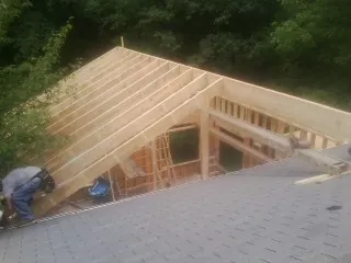 Framing a new roof addition that ties into an existing shingle roof in Glen Arm